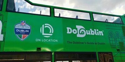 NFL Bus Close up of DoDublin Green Bus. NFL Branding on the side.