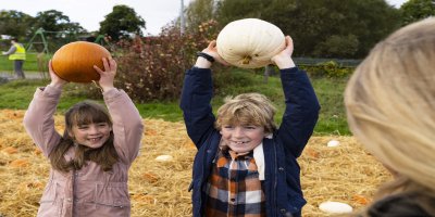 Courtesy Failte Ireland children holding pumpkins above their heads