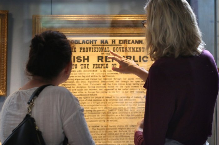 two women looking at the 1916 proclamation